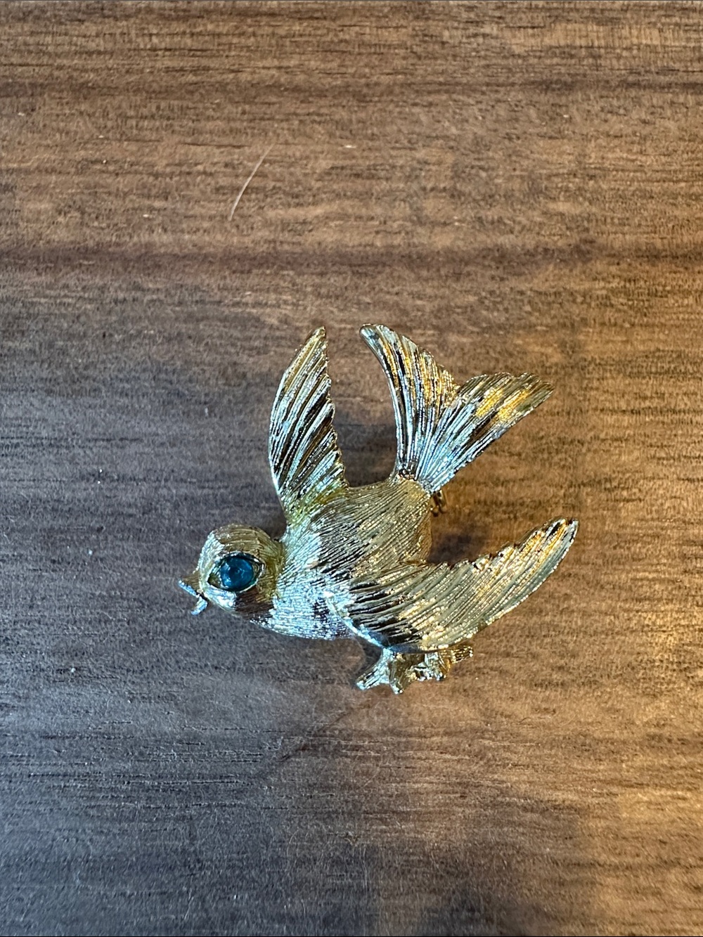 Gold toned Bird Pin with Blue Eye